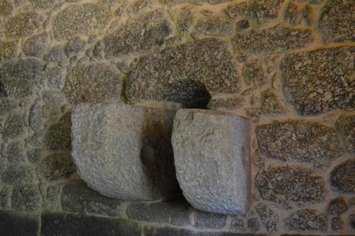 two stone vases sitting on a stone wall at Quinta do Medronheiro Hotel Rural in Viseu