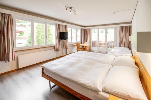 מיטה או מיטות בחדר ב-Roggenstock Lodge