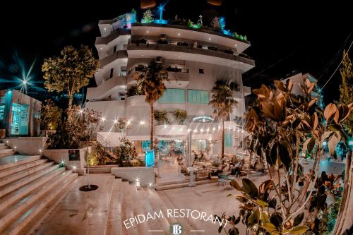 a cruise ship lit up at night at Illyrian Boutique Hotel in Sarandë