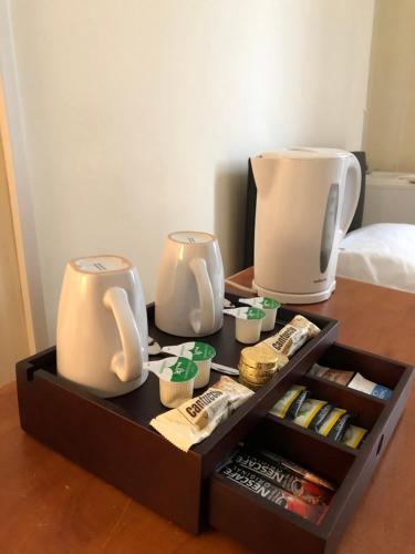 a table with two appliances on top of a table at Renfrew rooms at City Centre in Glasgow