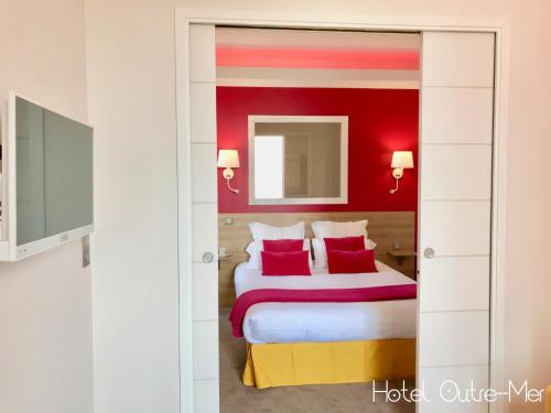 Postel nebo postele na pokoji v ubytování Hôtel Outre-Mer - Villa Le Couchant
