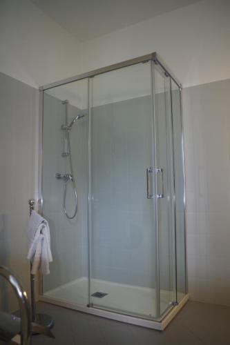 a shower with a glass enclosure in a bathroom at Da Francesca in Fiera di Primiero
