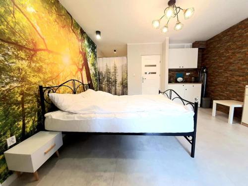 Katil atau katil-katil dalam bilik di Apartamenty w Puszczy