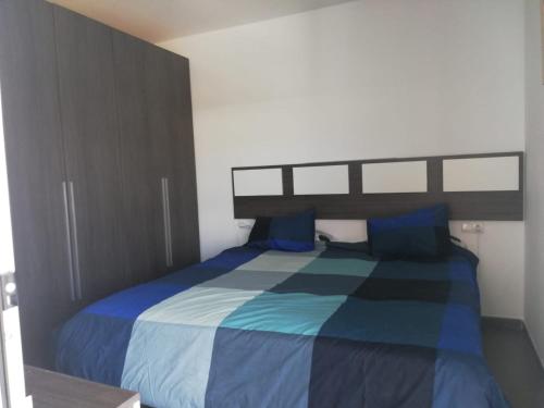 Giường trong phòng chung tại Apartamento Jardines del Campanario