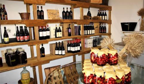 a display of bottles of wine on a shelf at Il Palazzo Ridracoli in Bagno di Romagna