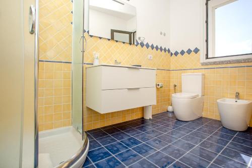 a bathroom with a sink and a toilet at B&B La Torre Elite in Santa Teresa Gallura