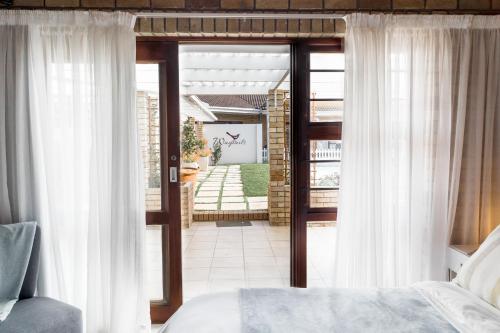 Ένα ή περισσότερα κρεβάτια σε δωμάτιο στο Wagtails Guest House