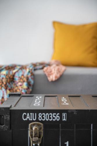 a black box sitting next to a couch at Noelia Suites in Oia