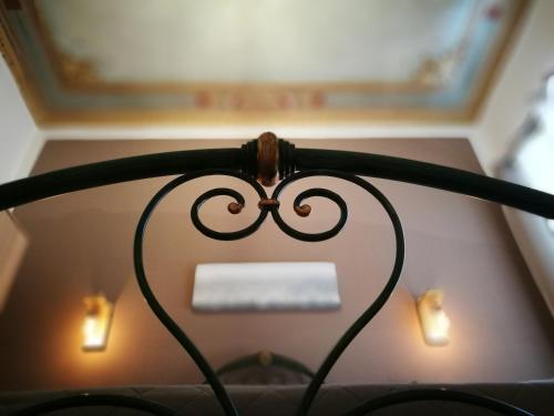 a wire in the shape of a heart hanging from a ceiling at BELLA PALERMO in Palermo