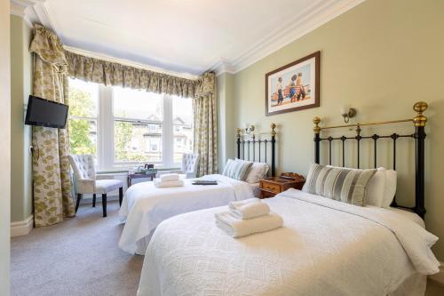 Кровать или кровати в номере Wynnstay House