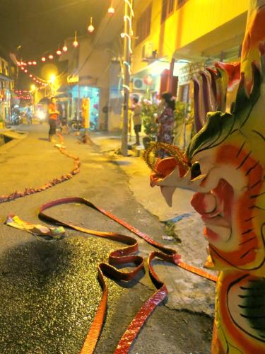 a kite on the side of a street at night at Pangkor Fish House in Pangkor