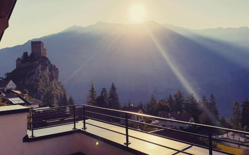 a view of the mountains from a balcony of a building at Apart Alpengenuss in Ladis