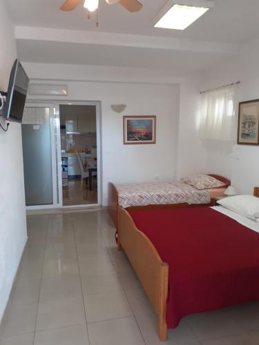 Katil atau katil-katil dalam bilik di Apartments Andrijašević