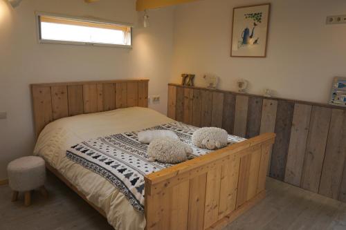Postel nebo postele na pokoji v ubytování B&B Zuiderkreek