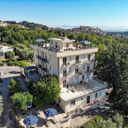 an aerial view of a large white building at Arts Club Suite & Spa in Chianciano Terme