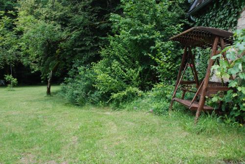 a garden with a gazebo in the grass at B&B Chateau le Bois in Saint-Julien-aux-Bois