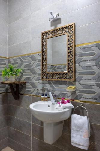 a bathroom with a sink and a mirror at Villa Can Kiko in Dahab