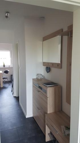 a kitchen with a sink and a counter top at Middeldiek Hooksiel in Wangerland