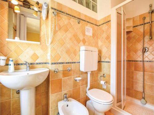 a bathroom with a sink and a toilet and a mirror at camera azzurra San Vito Lo Capo in San Vito lo Capo