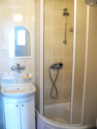 a bathroom with a shower and a sink at Villa pod Topolami in Okuninka
