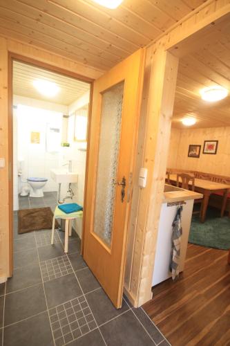 a bathroom with a sink and a toilet in a room at Ferienhaus Am Wald in Tambach-Dietharz