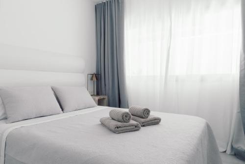 Postel nebo postele na pokoji v ubytování Guirre HolidayFV