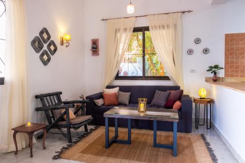 a living room with a couch and a table at Villa Can Kiko in Dahab