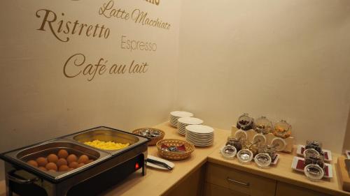 a table with eggs and other food items on it at Frühstückshotel Margret in Maurach
