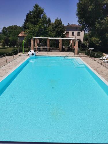 a blue swimming pool with a soccer ball on it at B&B Casazze Dream in Marcaria