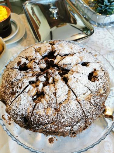 a cake sitting on a plate on a table at B&B Casazze Dream in Marcaria