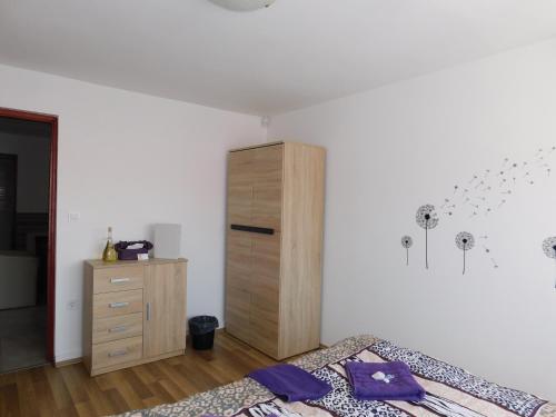 Кровать или кровати в номере 8888 Vendégház