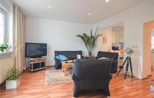 a living room with two chairs and a television at 2 Bedroom Lovely Home In Berlin in Berlin