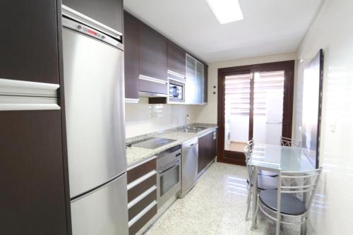 A kitchen or kitchenette at Monte Laguna - Clever Details