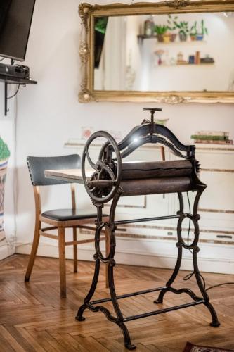 a hair dryer on a chair in front of a mirror at Baroque Hostel & Coworking in Budapest