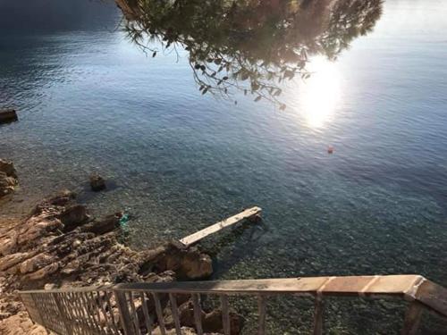 a view of a body of water with a dock at Old Town Sea Front M&M Apartment Korčula in Korčula