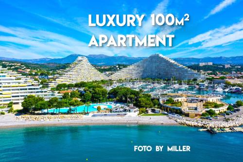 a poster of a resort with the words luxury apartment at Apartments at Commodoro in Villeneuve-Loubet