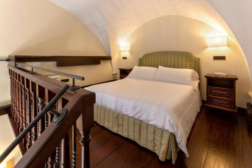 Ένα ή περισσότερα κρεβάτια σε δωμάτιο στο Hotel Fontebella