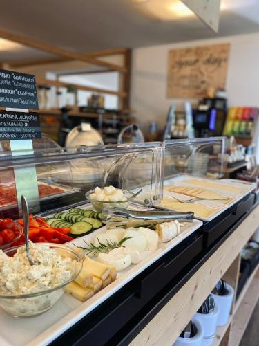 a buffet line with many different types of food at B&B Boutique Apartment Oberwiesen in Brunico