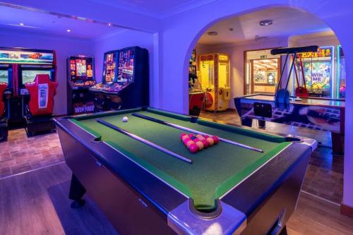 a billiard room with a pool table with balls at BRANWOOD Luxury Caravan Holidays Newquay in Newquay