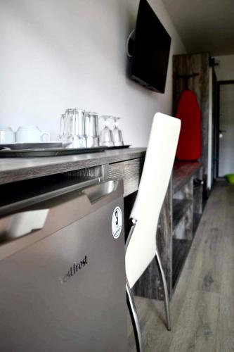 Телевизор и/или развлекательный центр в Village apartments Polyana
