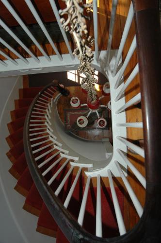 a view of a spiral staircase in a building at 29 India House in Nantucket