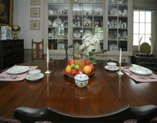 a wooden table with a bowl of fruit on it at 29 India House in Nantucket
