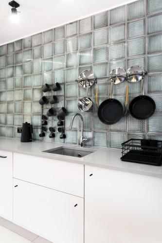 a kitchen with a white counter and a sink at Green Deer Premium in Zakopane
