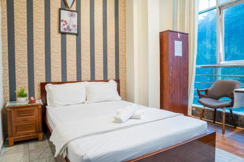Ліжко або ліжка в номері Aqua Kim Long Hotel