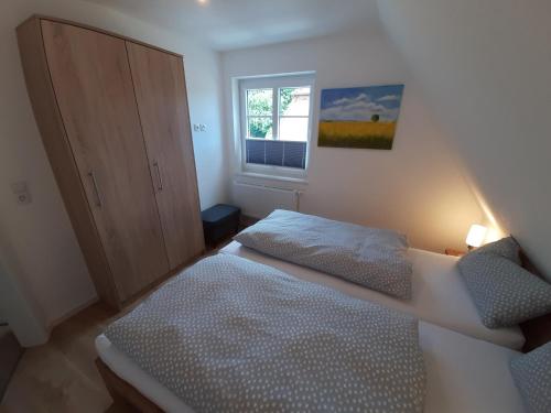 Postel nebo postele na pokoji v ubytování Ferienwohnungen Arp - Haus Inge