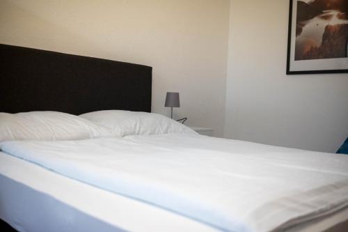 Ένα ή περισσότερα κρεβάτια σε δωμάτιο στο Hotel Quellenhof Bad Urach