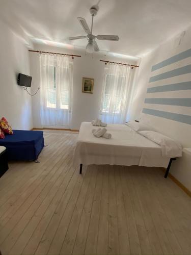 מיטה או מיטות בחדר ב-Vernazza Holidays Apartments