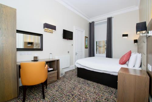 Ένα ή περισσότερα κρεβάτια σε δωμάτιο στο Albion Hotel