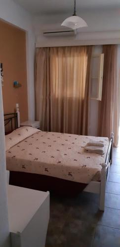 Postel nebo postele na pokoji v ubytování Antonia Rooms