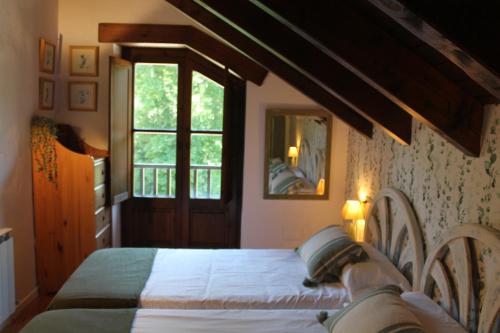 Postel nebo postele na pokoji v ubytování Hostal Casa Rosita